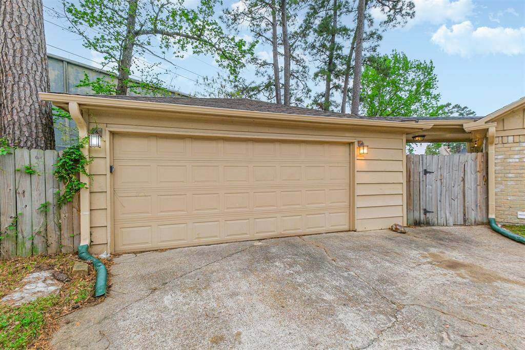 The home also has a detached garage with a covered walk-way from the garage leading to the back door.