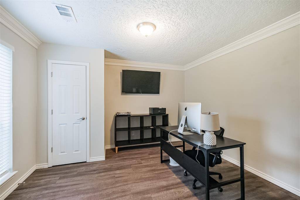 Just off the entrance is a bedroom currently being utilized as an office.