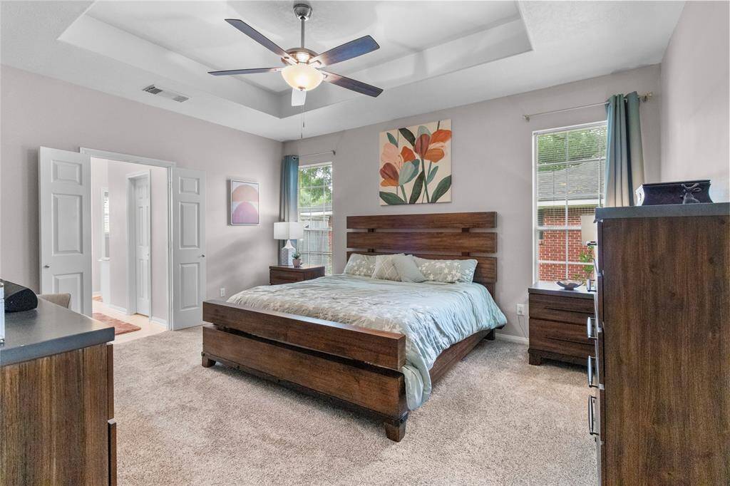 Large Primary Bedroom and trayed ceiling make this a great place to relax