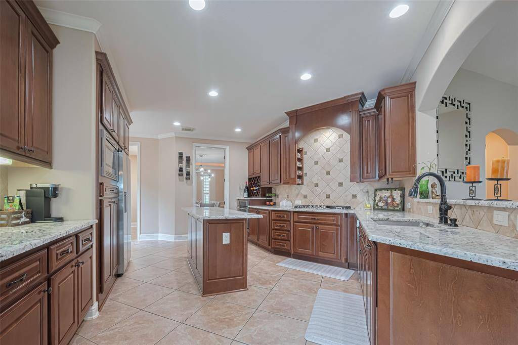 The open concept layout flows effortlessly into the living and dining areas—ideal for entertaining