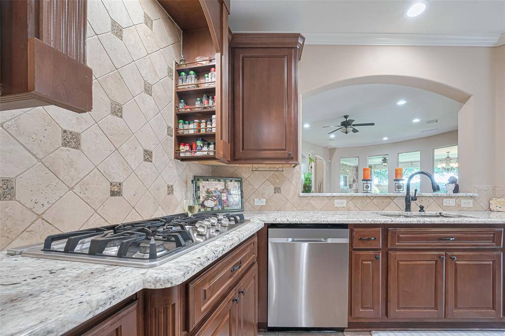 Stainless steel appliances, gas cooktop, and built-in microwave offer the perfect blend of luxury and convenience