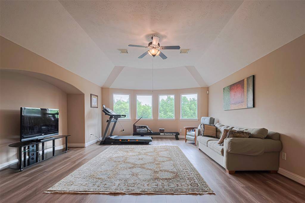 Upstairs, a generously sized game room offers the ultimate in flexibility—ideal for a media center, home gym, or playroom. This inviting room is perfect for both entertaining and relaxing