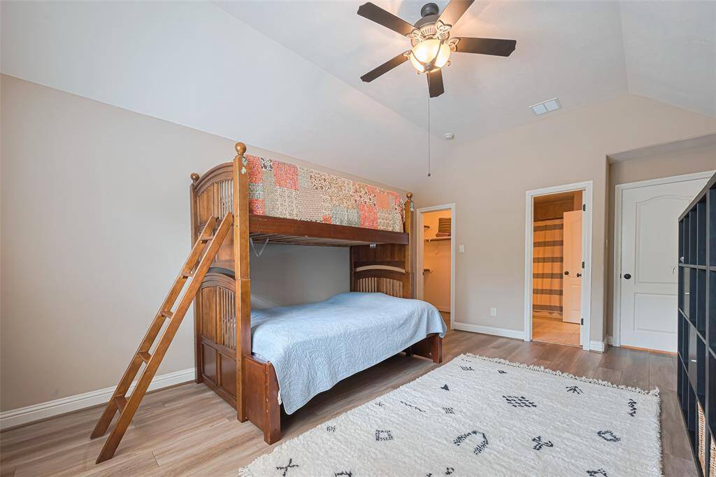 Wood-style flooring adds a modern and clean finish, while the ceiling fan ensures year-round comfort