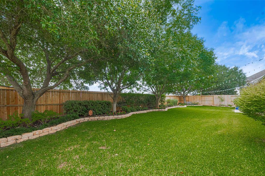 A dedicated garden bed offers space for growing your own vegetables or herbs, and there’s ample room for kids or pets to play
