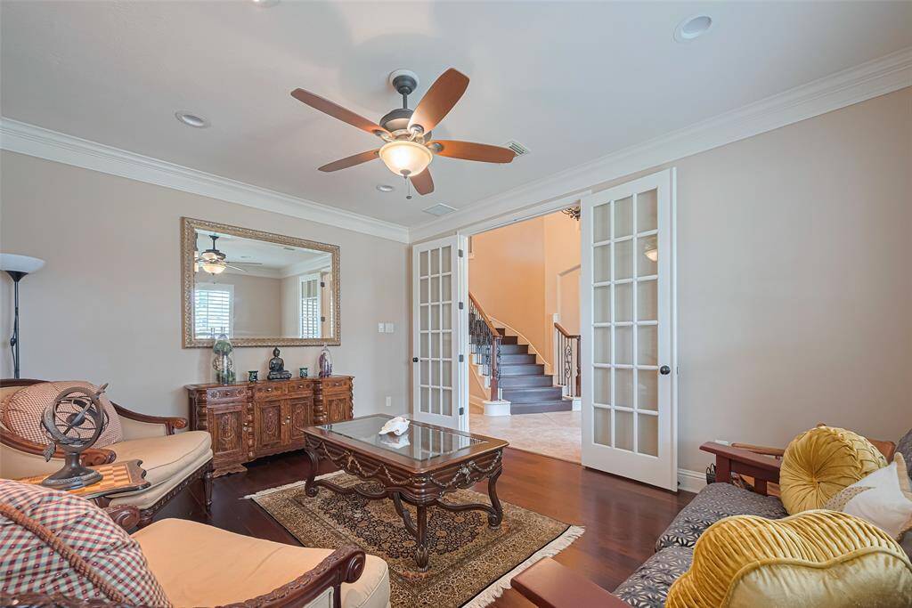 The neutral tones, custom lighting, and tray ceilings create a cohesive, spacious, and sophisticated atmosphere that’s perfect for everyday living or entertaining guests