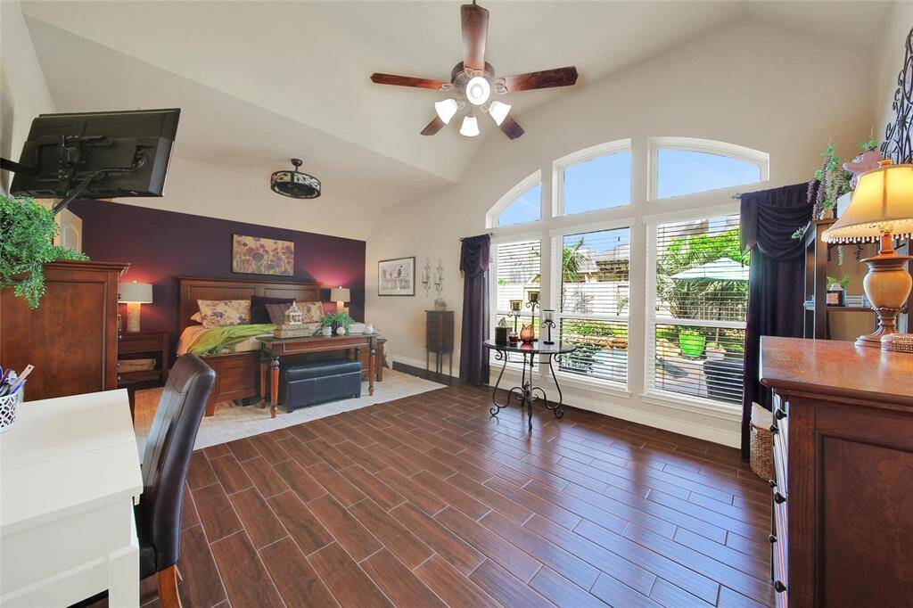 The massive primary suite is fit to house bedroom furniture with room for a sitting area and/or desk.