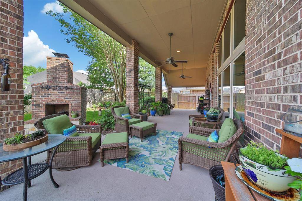 Positioned for shade in the afternoons and ceiling fans, the patio is perfect for winding down in the evenings.