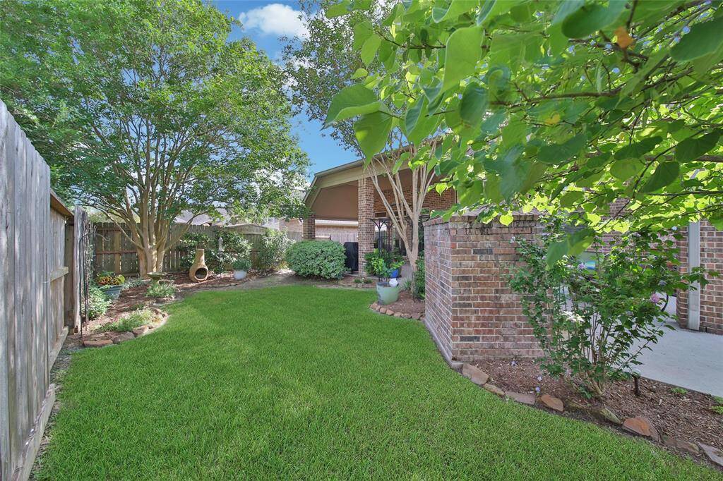 Enjoy the ample green space in addition to the large patio and pool.