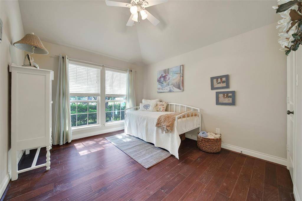 The front of the home houses a spacious secondary bedroom flooded with natural bright light.