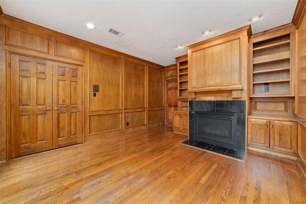 the office/study includes built ins and a fire place.