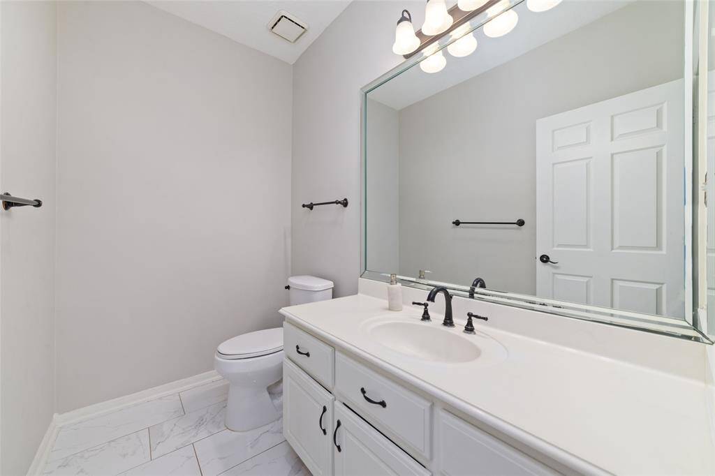 First floor half bath by the office/study.