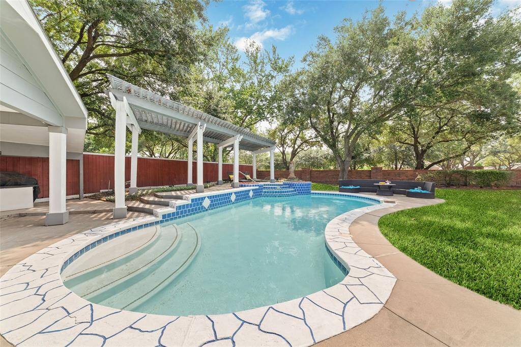 Enjoy your backyard oasis with a beautiful in ground pool and deck areas.