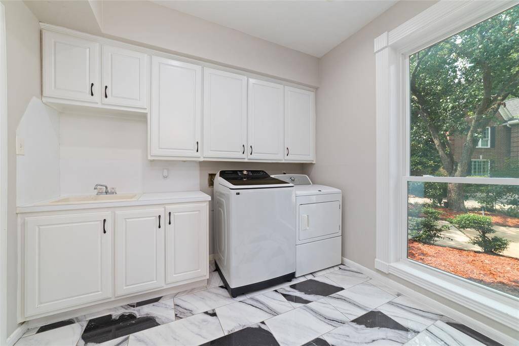 Downstairs laundry room off of the kitchen.
