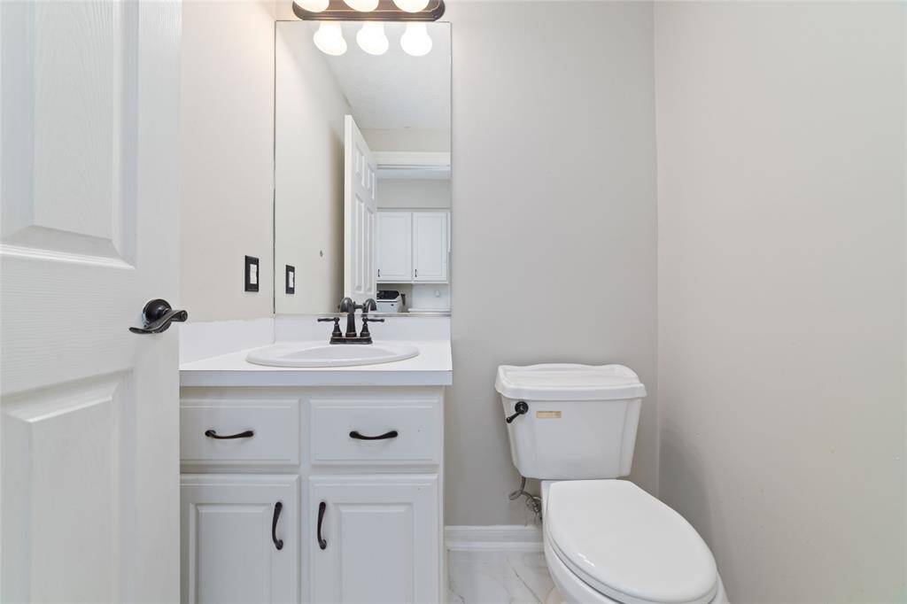 Downstairs half bathroom off of the laundry room.