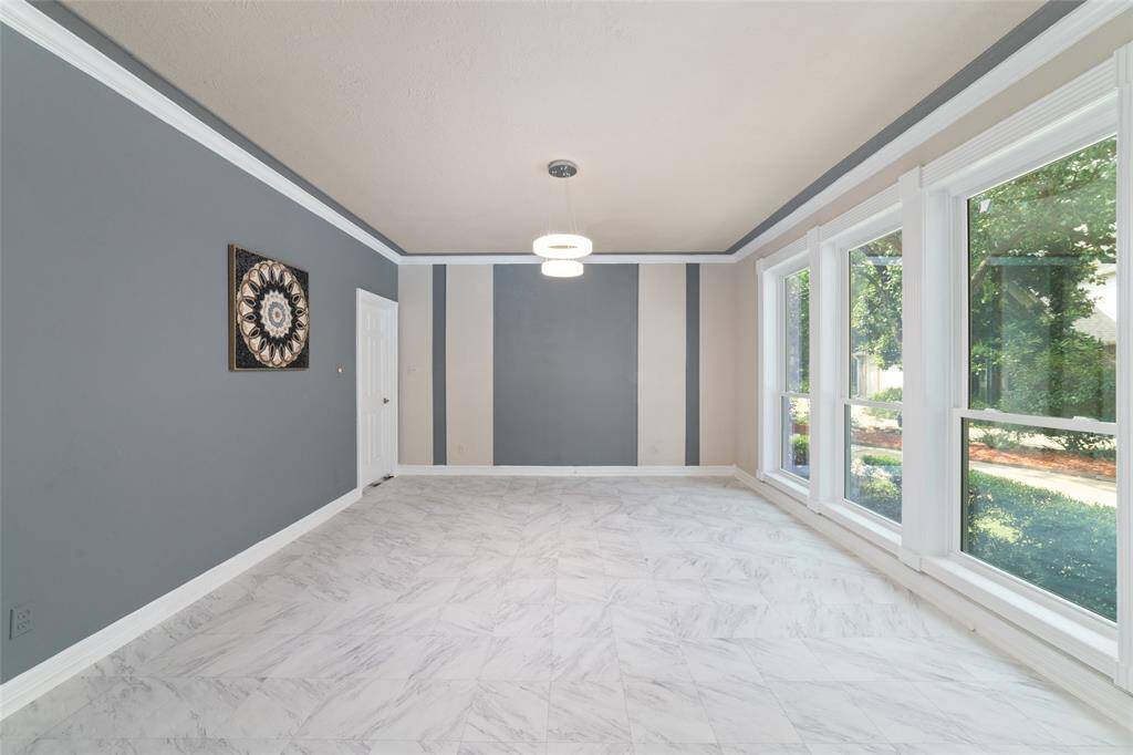 Upon entering the home on the right is a dining area or flex space with a door into the kitchen area.