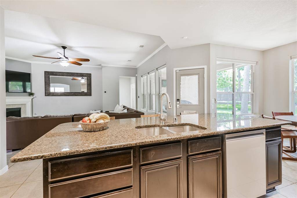 Turning towards the island we get a close look at the double basin stainless steel sink and the dish washer is also found on the island.
