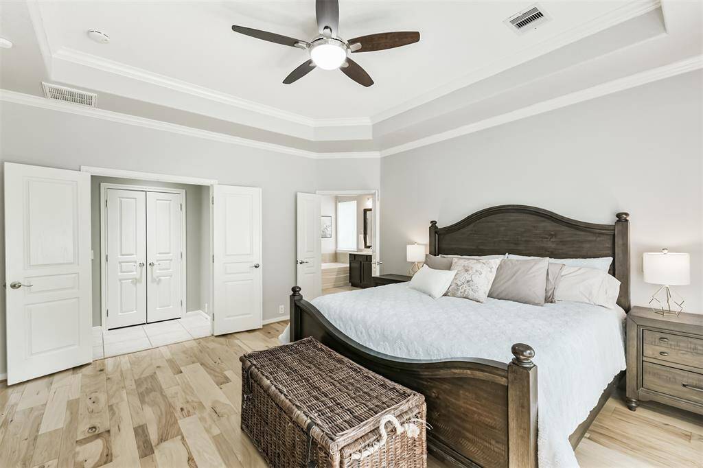 Serene and tranquil; the perfect combo for the primary suite. The double doors bring an added sense of luxury to the room.