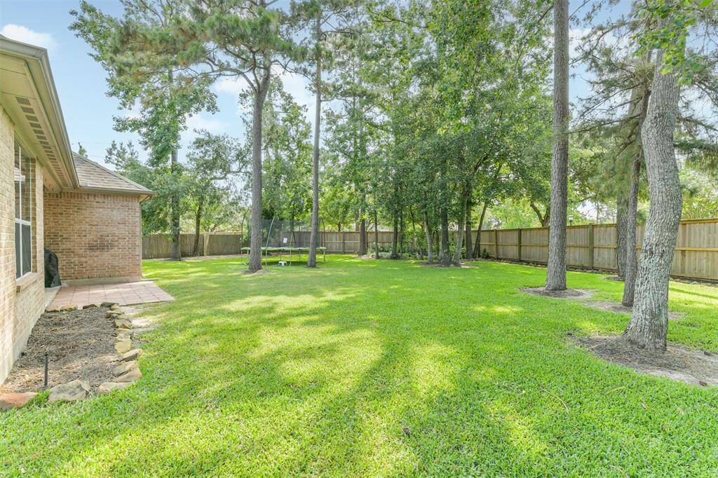 Enjoy the yard in the ample shade provided by the mature trees.