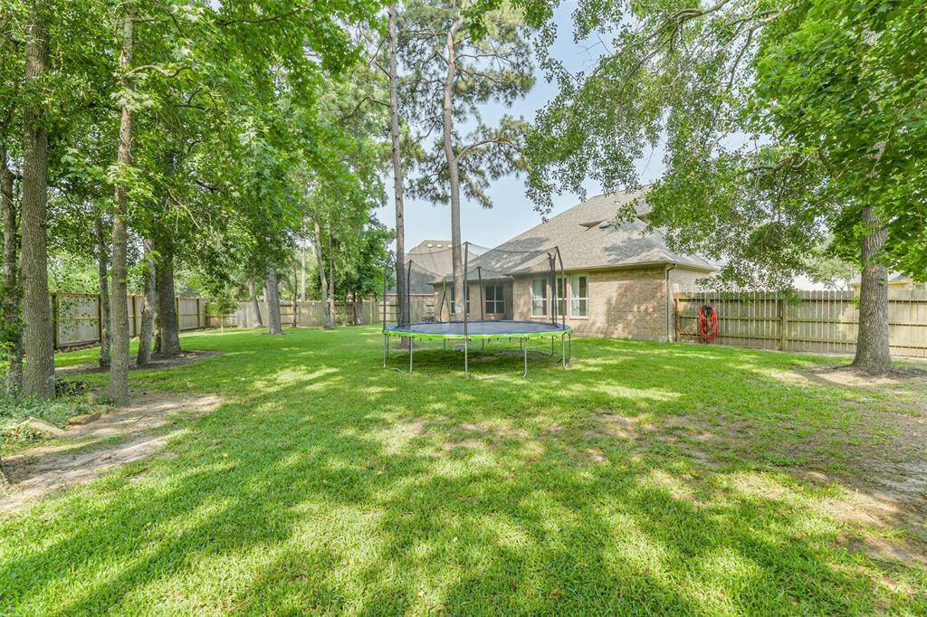 Standing in the back corner looking towards the patio.