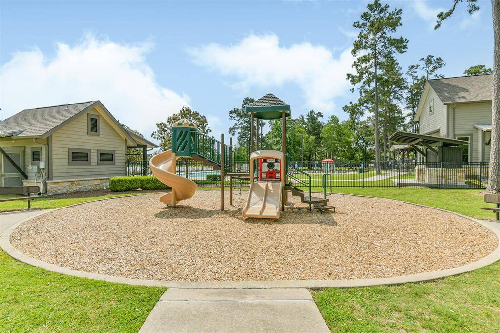 A short distance from the home is the community club house and this playground.