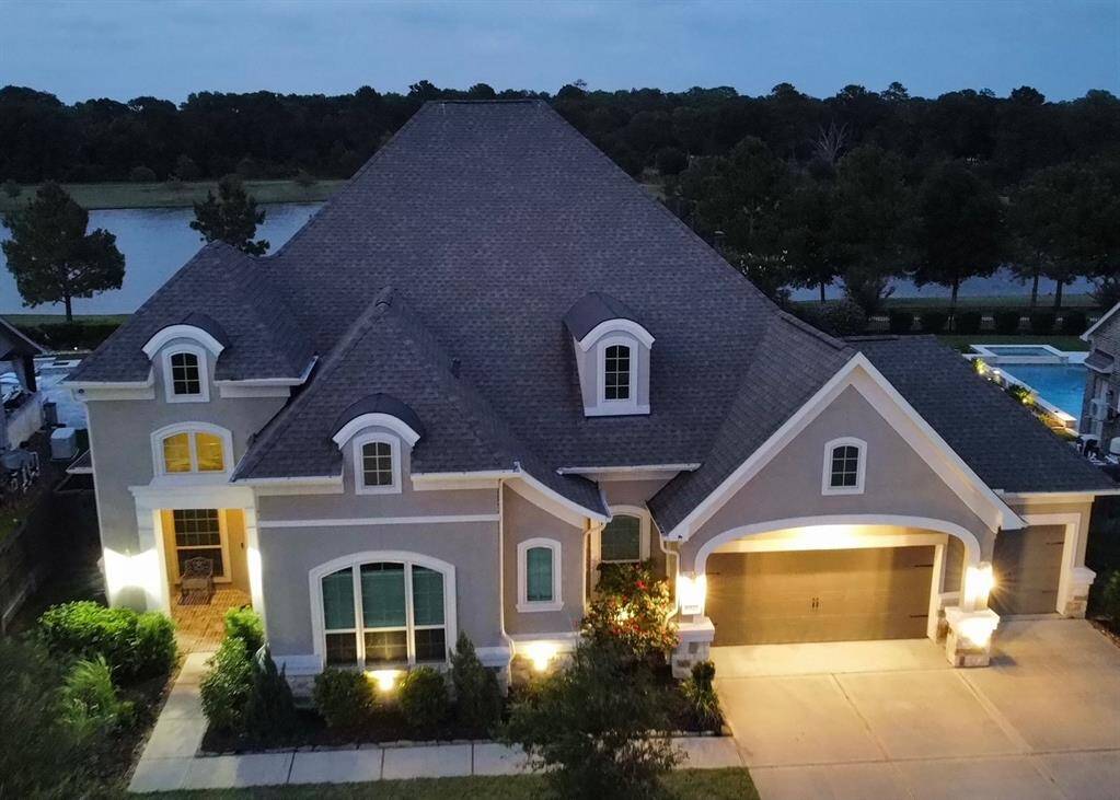 Welcome home to this magnificent lake front one story home in quiet Falls at Dry Creek in Cypress.