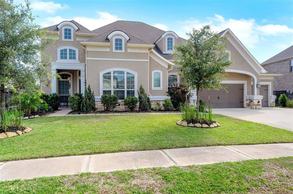 This home not only has a 5 car garage but also whole home generator.