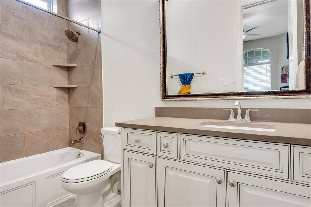 Full en-suite  bath is attached to the bedroom/exercise room door for convenience.