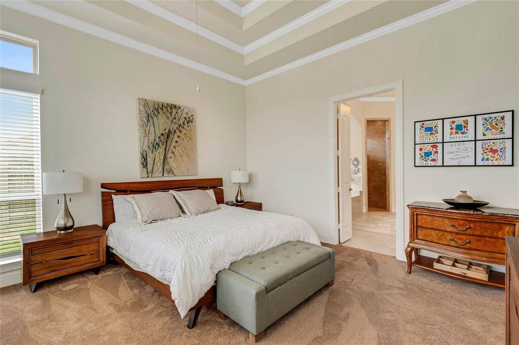 Another view of the spacious primary suite.  Village builders puts SO many extra details in their homes.
