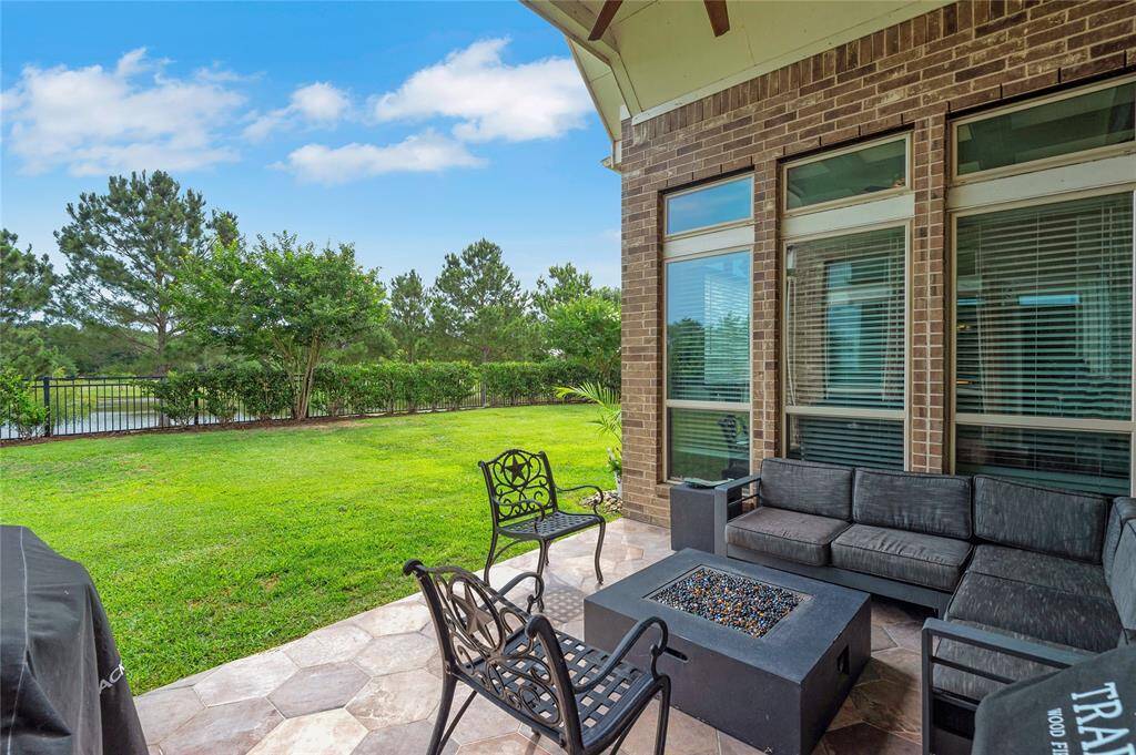 What a view! Relax on your covered back patio with a refreshing lemonade or glass of wine and enjoy that stunning lake view.