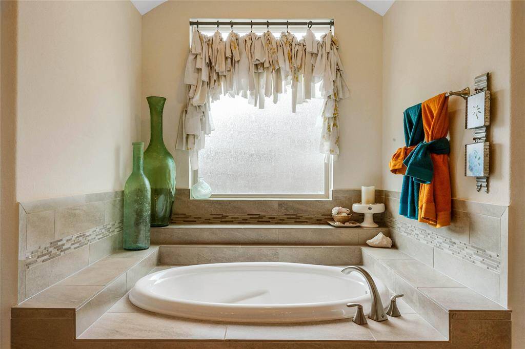 Get your bubble bath or fancy bath bomb ready for some relaxation time in this large soaking tub.
