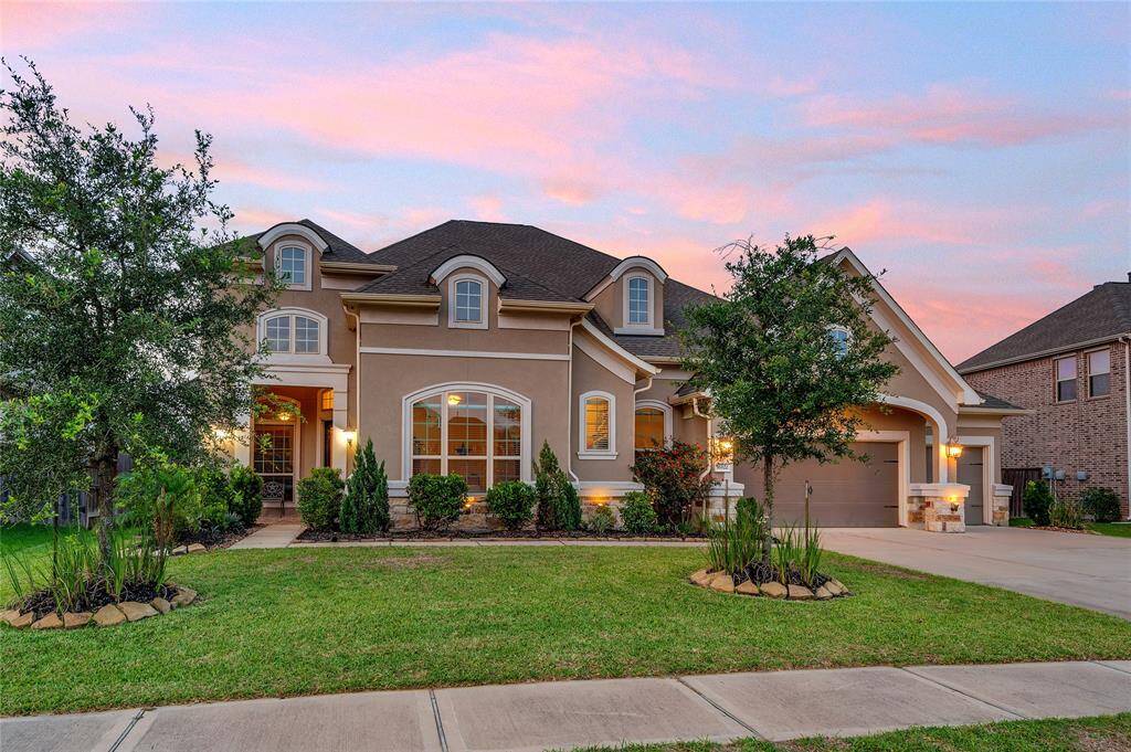 Beautiful uplighting warmly illuminates the home.