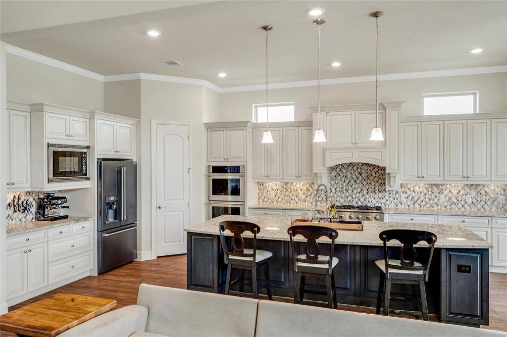 Your beautiful new kitchen has extra counter and cabinet space to the left that is currently being used as a convenient coffee bar.  Isn't that a great idea?