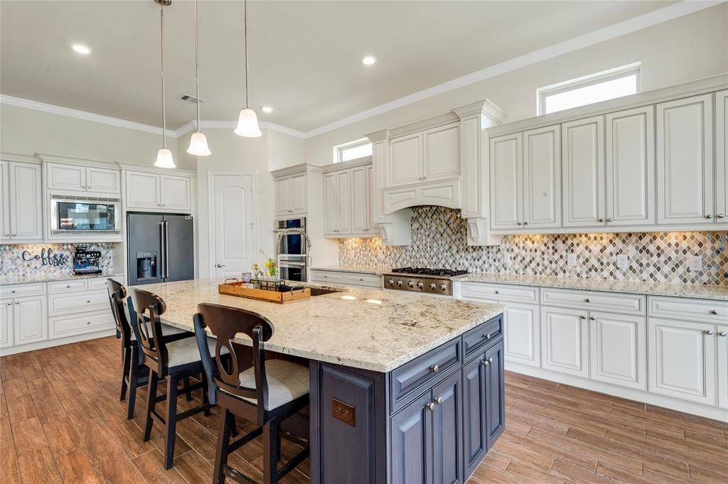 The kitchen just keeps going on and on. Can you see there are even cabinets on the side of the island?  SO much storage!