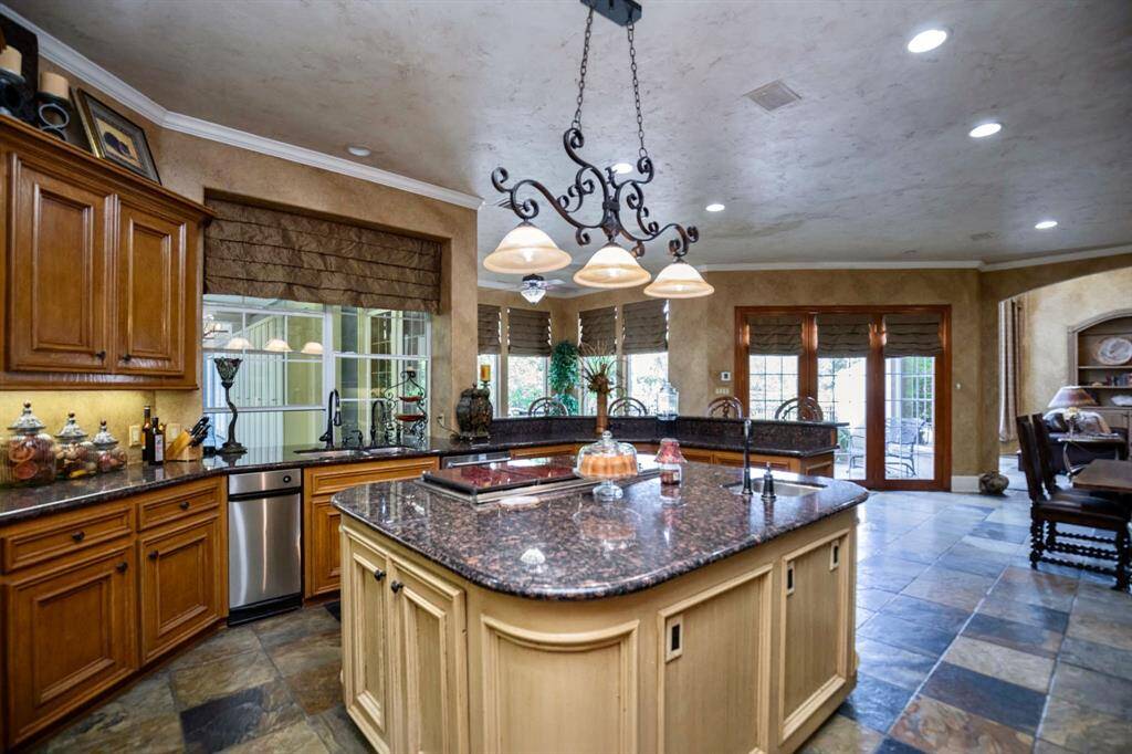 ENJOY YOUR FOOD PREP ON THIS HUGE CENTER ISLAND OVERLOOKING THE INCREDIBLE PARK-LIKE GROUNDS!