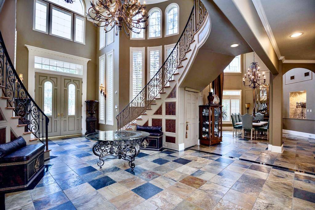 ANOTHER VIEW OF THE ELEGANT FOYER!!! SOARING CEILINGS AND BEAUTIFUL CUSTOM DETAILS GIVE THIS HOME A ROYAL PRESENCE!!!