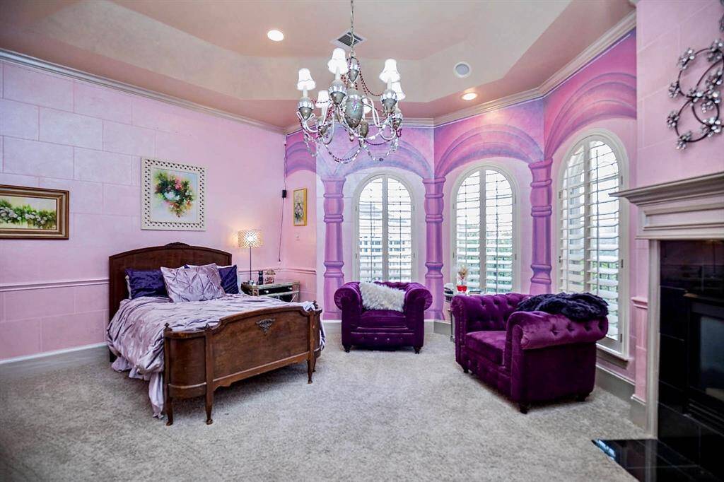 THIS SPACIOUS SECONDARY BEDROOM IS A DREAM SUITE, COMPLETE WITH BAY WINDOWS AND CUSTOM FIREPLACE!