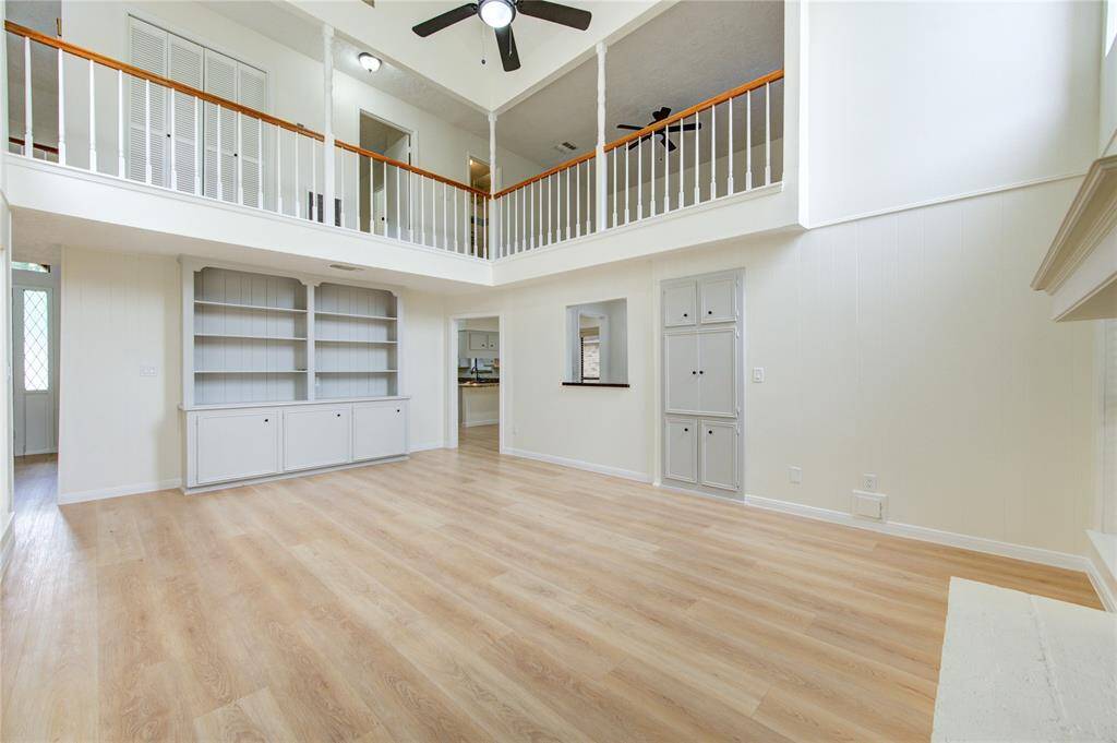 Family room. Front door to the left, kitchen through center opening.