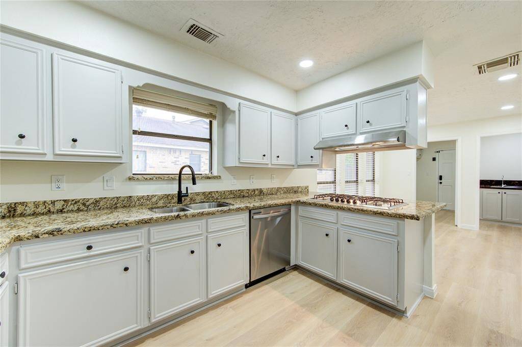 The kitchen is open to the dining area.