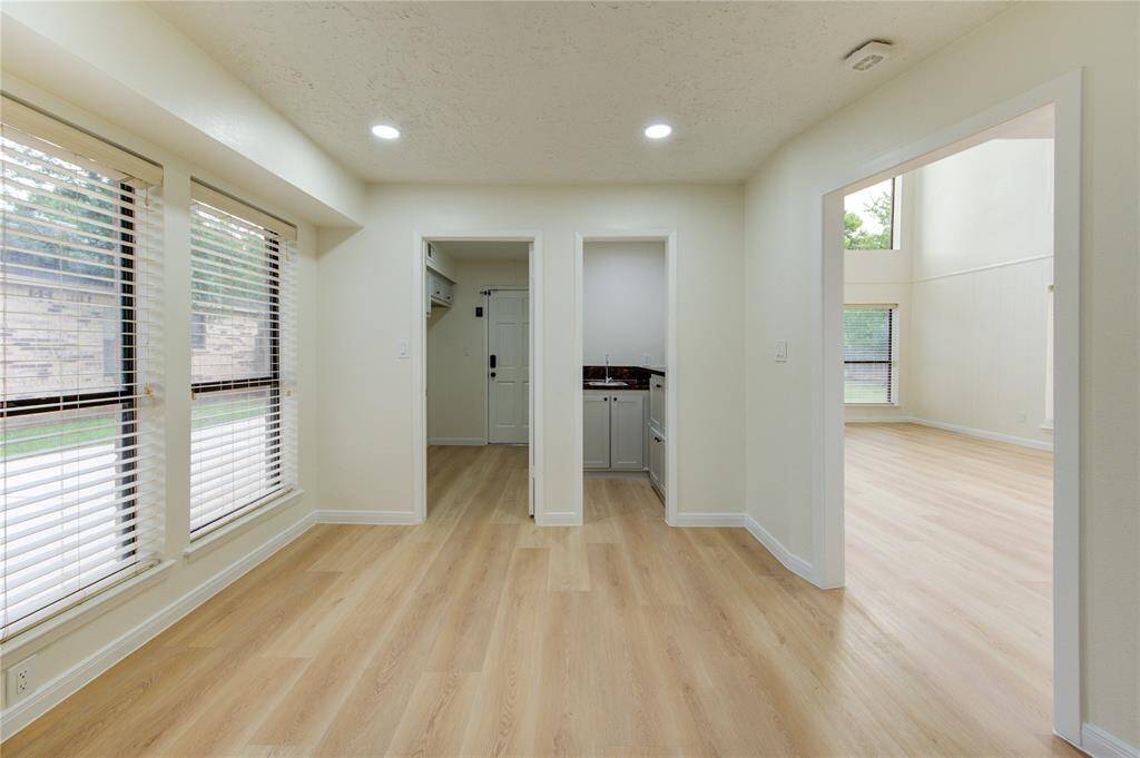 Dining area. Utility room on left. Wet bar center. Family room on right.