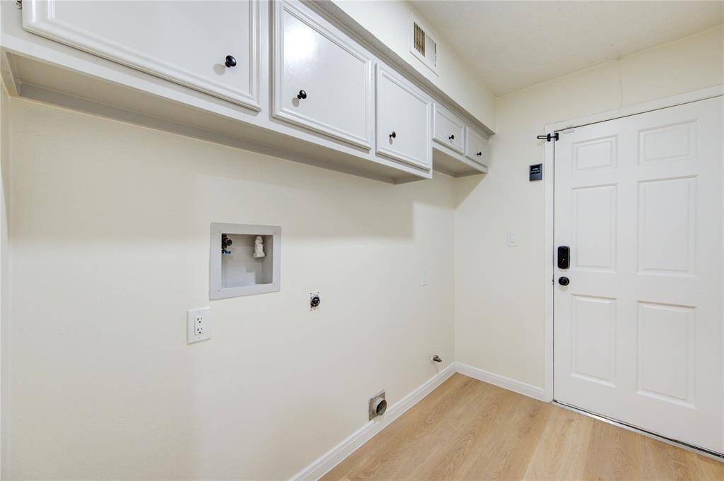 Utility room with gas and electric connections.