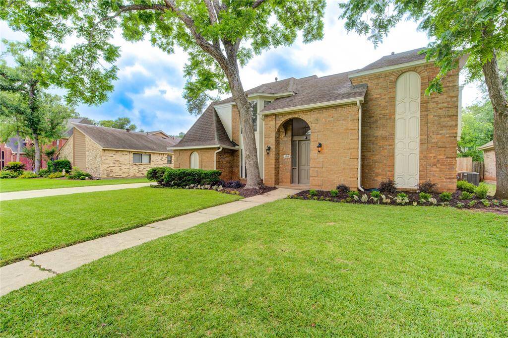 Fresh landscaping and mature trees.