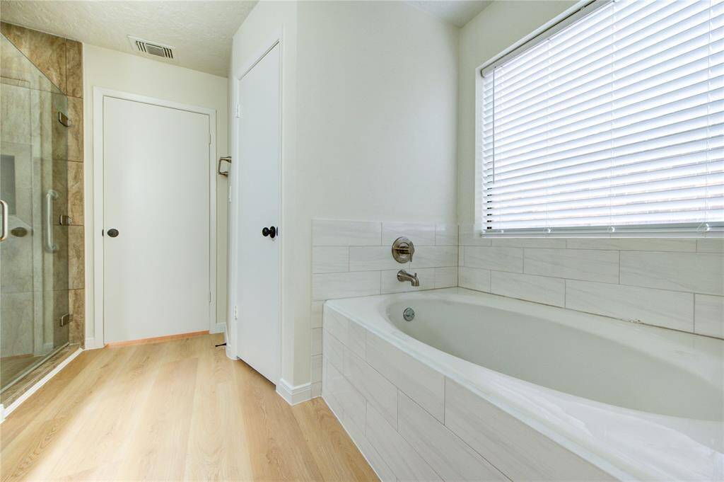 Soaking tub in the primary bathroom.