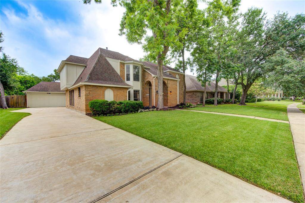 Extra long driveway for additional parking space.