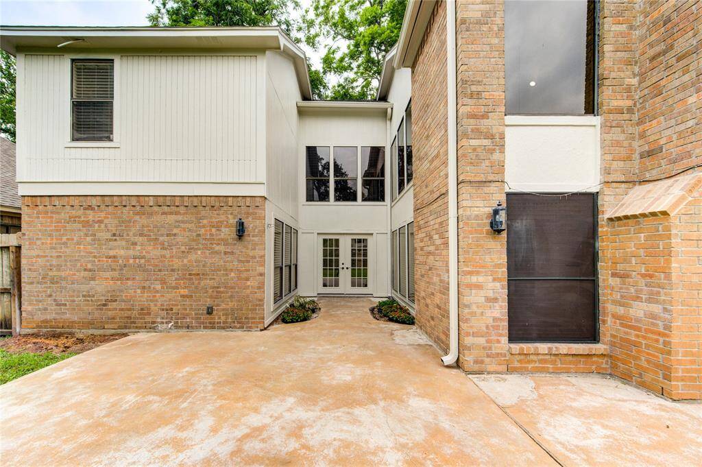 Spacious back patio with beautiful french doors!