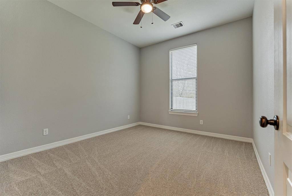 One of three secondary bedrooms - all with fans!
