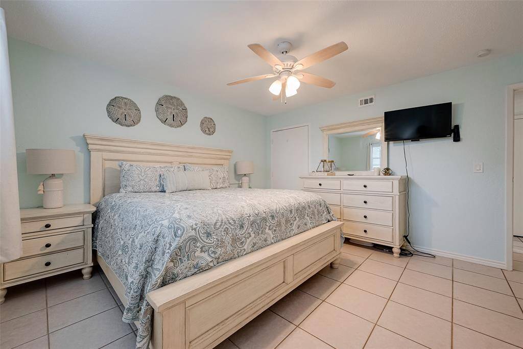 Soft neutral tones paired with pastel turquoise walls create a serene and inviting atmosphere.
