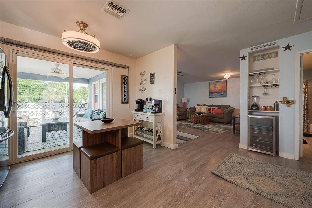 Just steps from the balcony, this well-planned kitchen connects seamlessly to the living area. A built-in shelf on a recessed wall adds both function and character, offering storage and display space.
