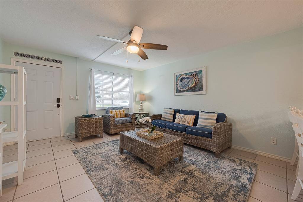 In the downstairs unit, the front door opens directly into the spacious living area with tiled flooring, setting the stage for comfortable daily living.