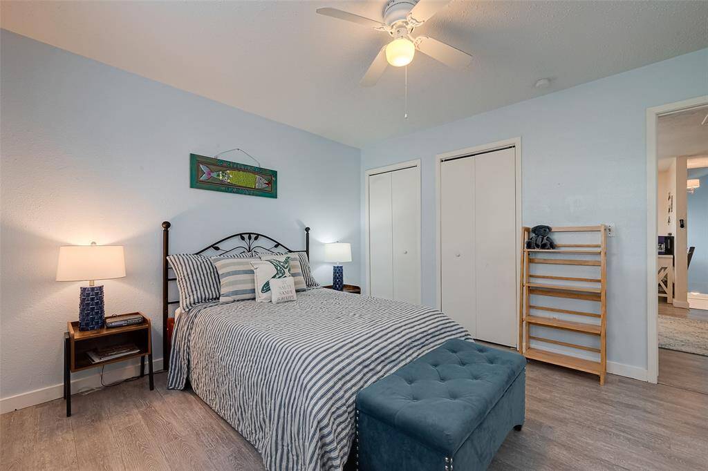 Soft pastel blue walls blend with neutral tones, creating a calming ambiance that complements the coastal surroundings.