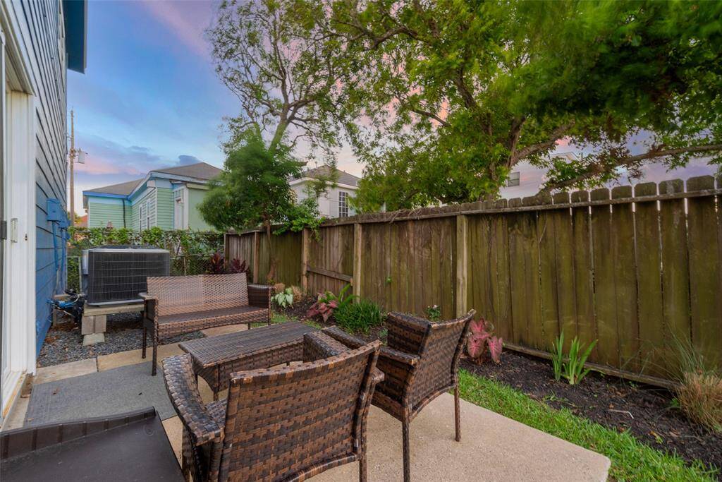 As the sun sets, the patio transforms into a peaceful spot to unwind under the evening sky.